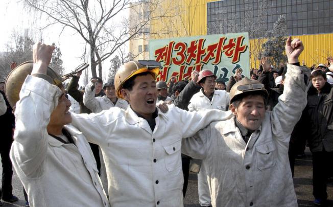 North Korean workers celebrate North Korea's nuclear test. Photo: Reuters
