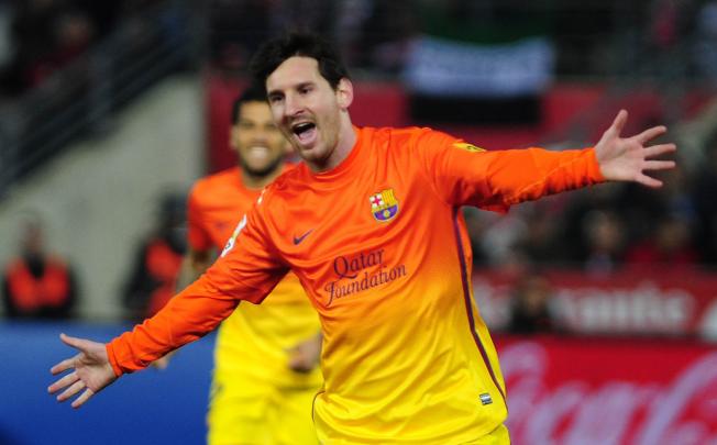 Lionel Messi celebrates after scoring against Granada on Saturday. Photo: AFP