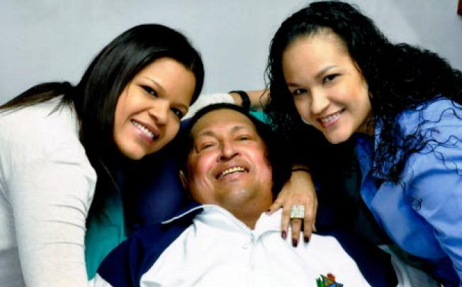 Venezuela's President Hugo Chavez (centre) last week with his daughters, Maria Gabriela (left) and Rosa Virginia in Havana, Cuba. Photo: AP