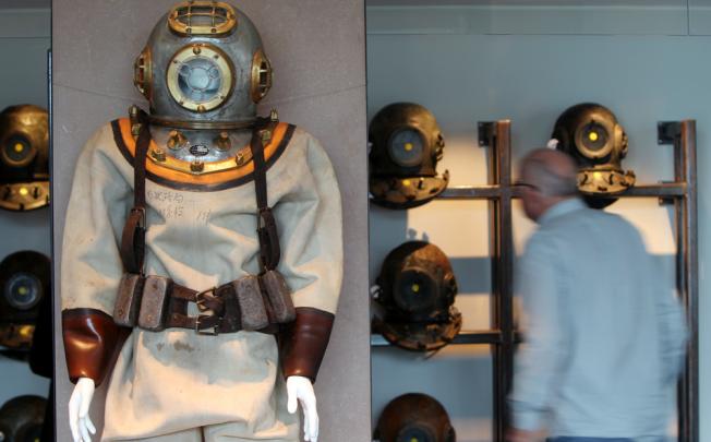 Diving helmets displayed at Hong Kong Maritime Museum. The brass bell of the former three-masted Chilean training ship, 'General Baquedano', will also be displayed as part of an exhibition. Photo: David Wong
