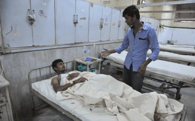 A bomb blast victim is treated at Osmania Hospital in Hyderabad. Twin bombings killed at least 20 people on Thursday. Photo: AFP