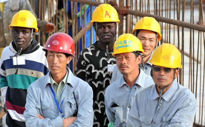 Migrant workers from the mainland, such as these construction workers in Senegal, are willing to make sacrifices to escape poverty at home. Photo: AFP