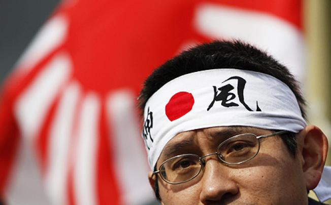 A protester takes part in an annual Takeshima Day anti-South Korea rally in Tokyo on Friday over the disputed islands called Takeshima in Japan and Dokdo in South Korea. Photo: Reuters
