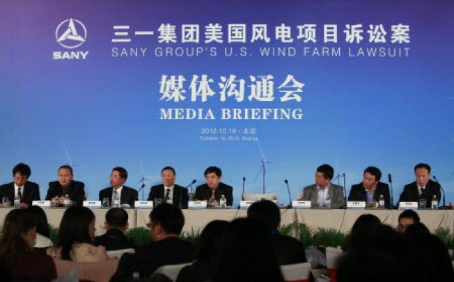 China's machinery maker Sany Group held a press conference on their plans to sue US President Barack Obama after he blocked Ralls Corp., an affiliate to Sany, from purchasing four wind farms in Northern Oregon. Photo: EPA