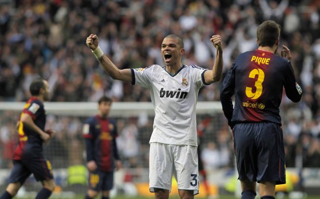 Real Madrid's Pepe (left) celebrates while Barcelona 