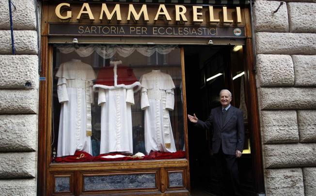 Vestments for the new pope are displayed in the window of Gammarelli, the ecclesiastical tailors in Rome. Photo: Reuters