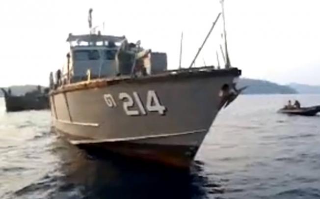 Villagers on Surin island captured on video a Thai military patrol boat, with the hull designation TOR214, as it towed a Rohingya vessel later caught up in the alleged shooting. Photo: Phuketwan