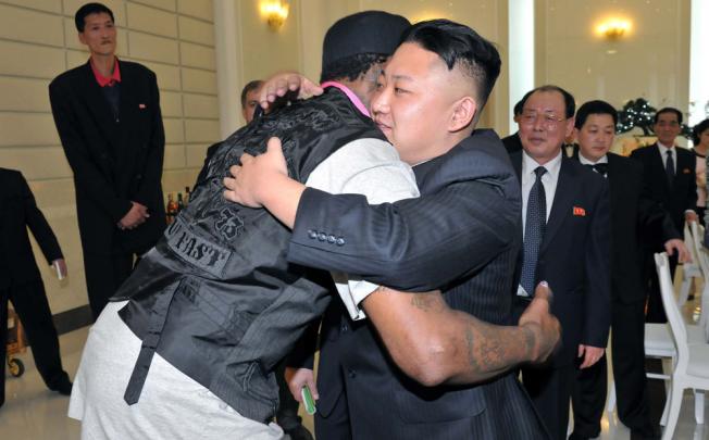 North Korean leader Kim Jong-Un and former NBA basketball player Dennis Rodman hug in Pyongyang. Photo: Reuters