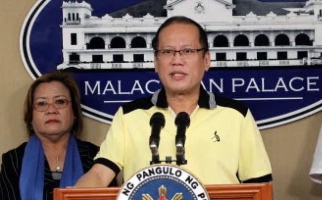 Philippine President Benigno Aquino and Justice secretary Leila de Lima (left). Aquino has asked Lima to probe claims police and soldiers executed 13 people. Photo: AFP 