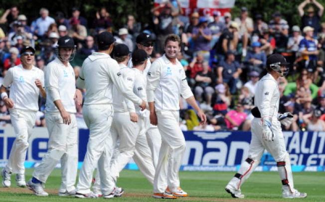New Zealand's Bruce Martin (centre) celebrates on the second day of the 1st international cricket test in Dunedin, New Zealand, on Thursday. Photo: AP