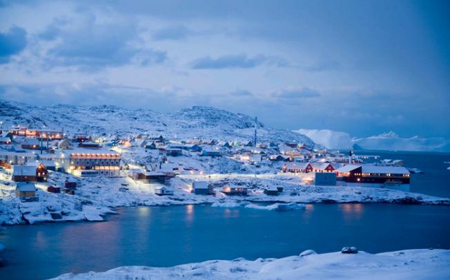 Late afternoon in the main harbour of Ilulissat, Greenland, land of the midnight sun in the summer. Photo: Berne Broudy