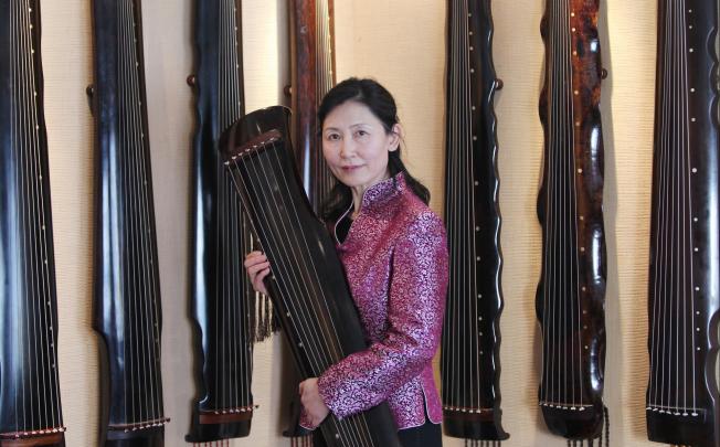 Huang Wenyi's love for the seven-stringed guqin began in earnest about 14 years ago in Beijing and she has since compiled a lesson book with 20 pieces of the instrument's works for her students. Photo: Simon Song