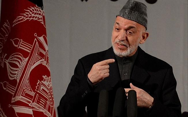 Afghan President Hamid Karzai speaks at a gathering of women to mark International Women's Day, in Kabul. Photo: AFP