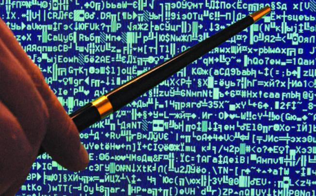 The code of a computer virus. Photos: Corbis; AFP