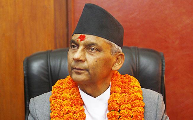 Nepal's newly-appointed Prime Minister Khilraj Regmi assumes office after being sworn in in Katmandu, Nepal, on Thursday. Photo: AP