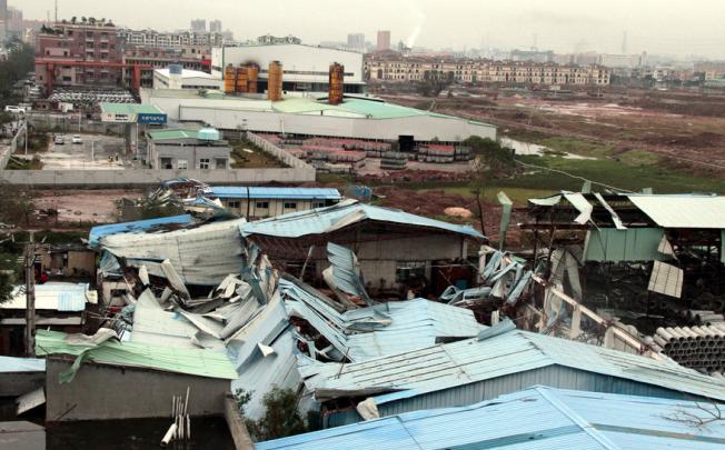Hail and storms damaged buildings in Dongguan. Photo: Xinhua