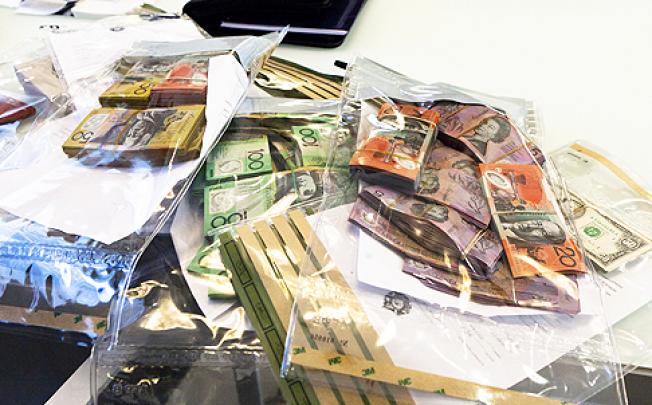 Some of the A$4 million cash confiscated by the Australian Federal Police. Photo: AFP