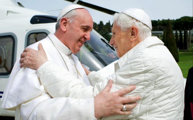 Pope Francis (left) yesterday embraces Benedict at Castel Gandolfo in Italy, where the latter lives in seclusion. Photo: AP