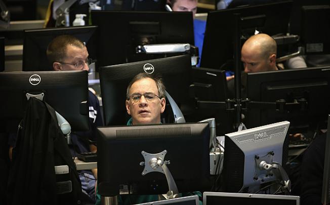 Traders montor offers in the CBOE Volatility Index (VIX) pit at the Chicago Board Options Exchange. Photo: AFP