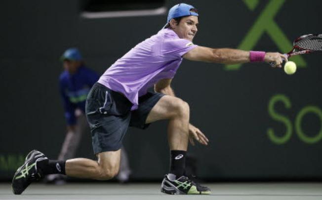 Germany's Tommy Haas stretches for a shot from Serbia's Novak Djokovic in their men's singles fourth round match at the Sony Open tennis tournament in Key Biscayne, Florida. Photo: Reuters