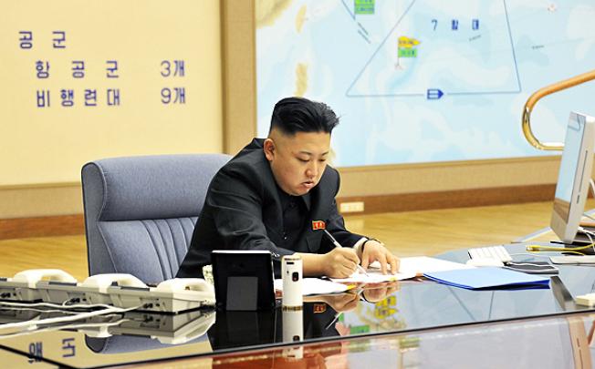 North Korean leader Kim Jong-Un discusses the US strike plan with North Korean officers during an urgent operation meeting at the Supreme Command. Photo: AFP