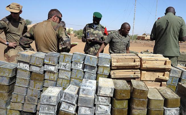 French and Malian soldiers stand next to cases of ammunition in Gao, northern Mali. Photo: AFP