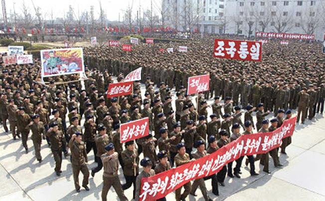 North Koreans attend a rally to show they are ready for a possible war against the United States and South Korea in Nampo. Photo: Reuters