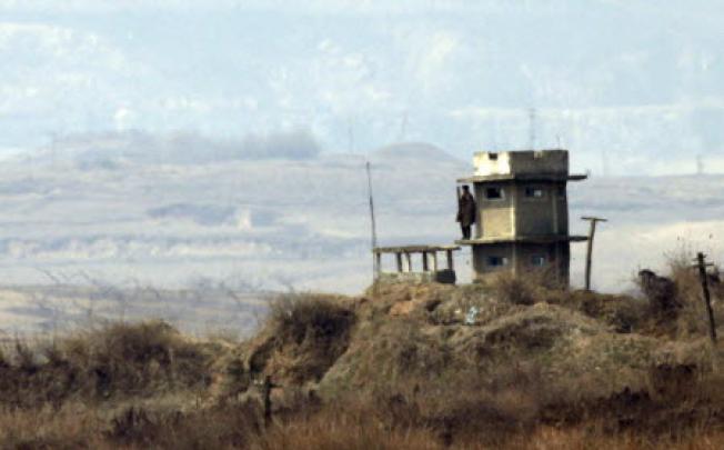 A North Korean soldier at a guard post near the inter-Korean Kaesong industrial complex from a South Korean observation post near the demilitarised zone separating the two Koreas in Paju. Photo: Reuters 