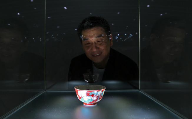 William Chak admires his "flawless" falangcai bowl. 