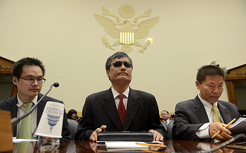 Chinese dissident Chen Guangcheng (centre) appears before the US House Foreign Affairs Committee. Photo: EPA