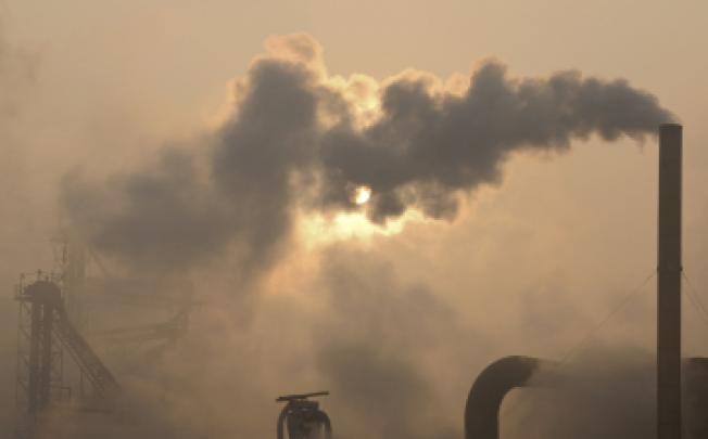Emissions from chimneys of a cement plant in Binzhou city, in eastern China's Shandong province. The UN says the world's climate change goal at now risk because emissions are surging, says the UN. Photo: AP