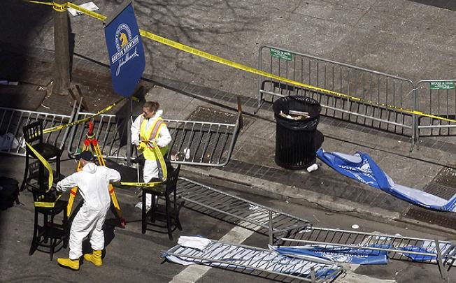 FBI investigators seal off the crime scene in central Boston. Photo: AFP