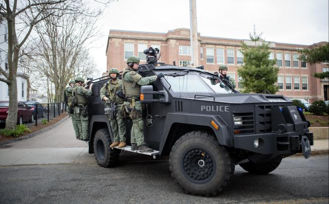 SWAT team officers after clearing a building in Watertown, Massachusetts. Photo: NYT