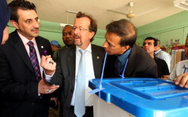 UN Special Envoy to Iraq visits a polling station in Baghdad during the Iraqi provincial elections in Baghdad on Saturday. Photo: AFP