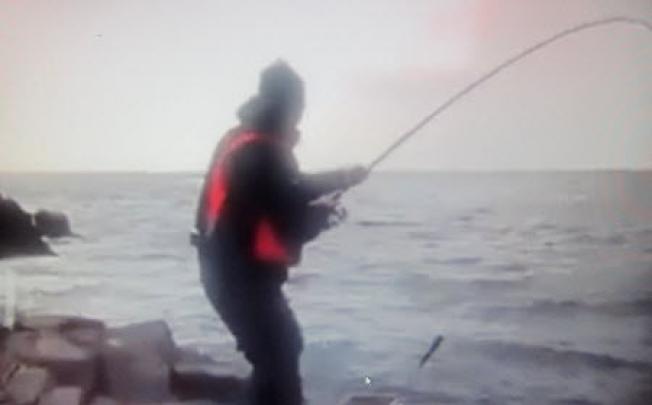 An image from the video shows the shark on the end of an angler's line in Sai Kung. Photo: Red Door News