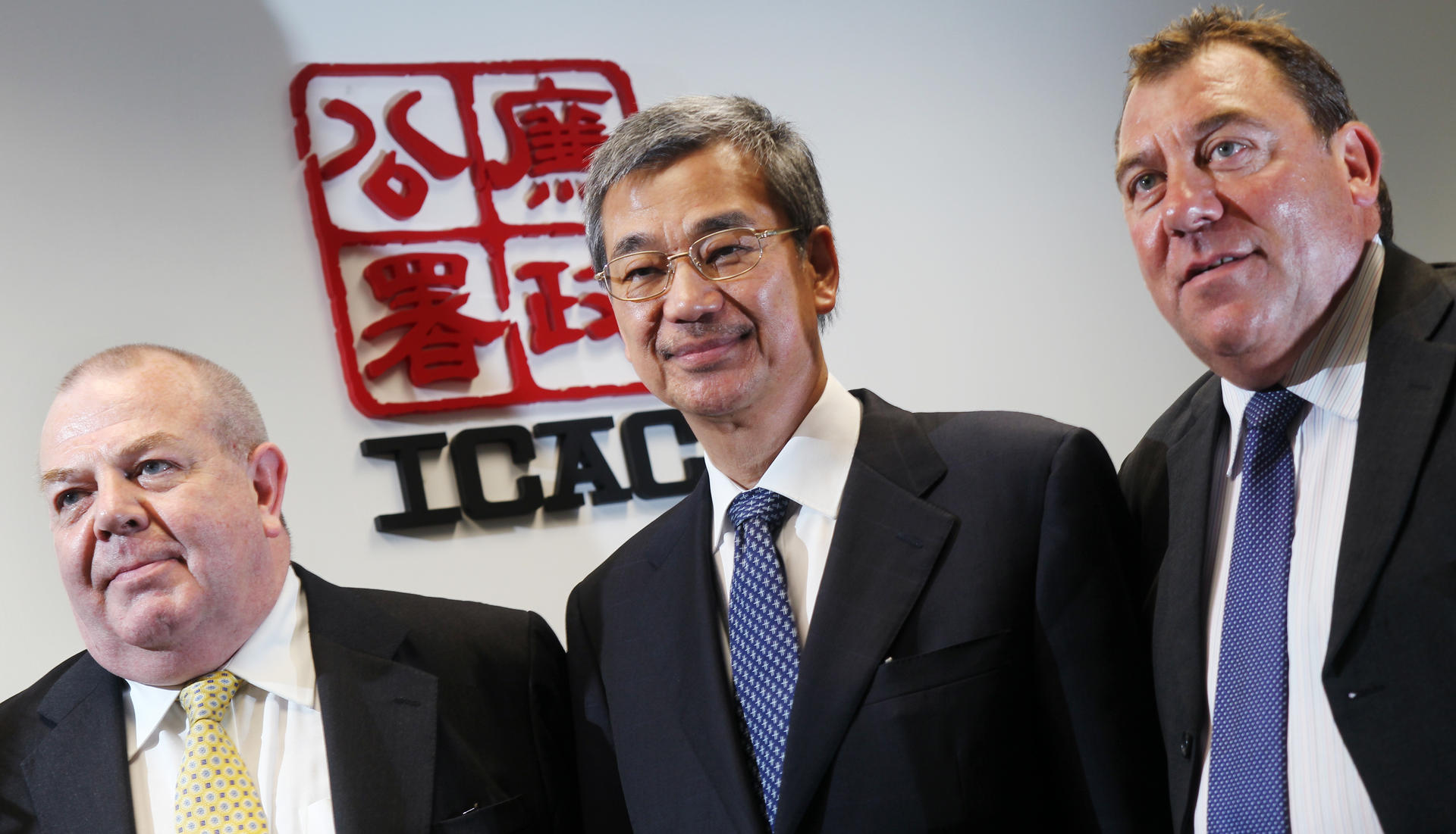Former ICAC boss Timothy Tong (centre)