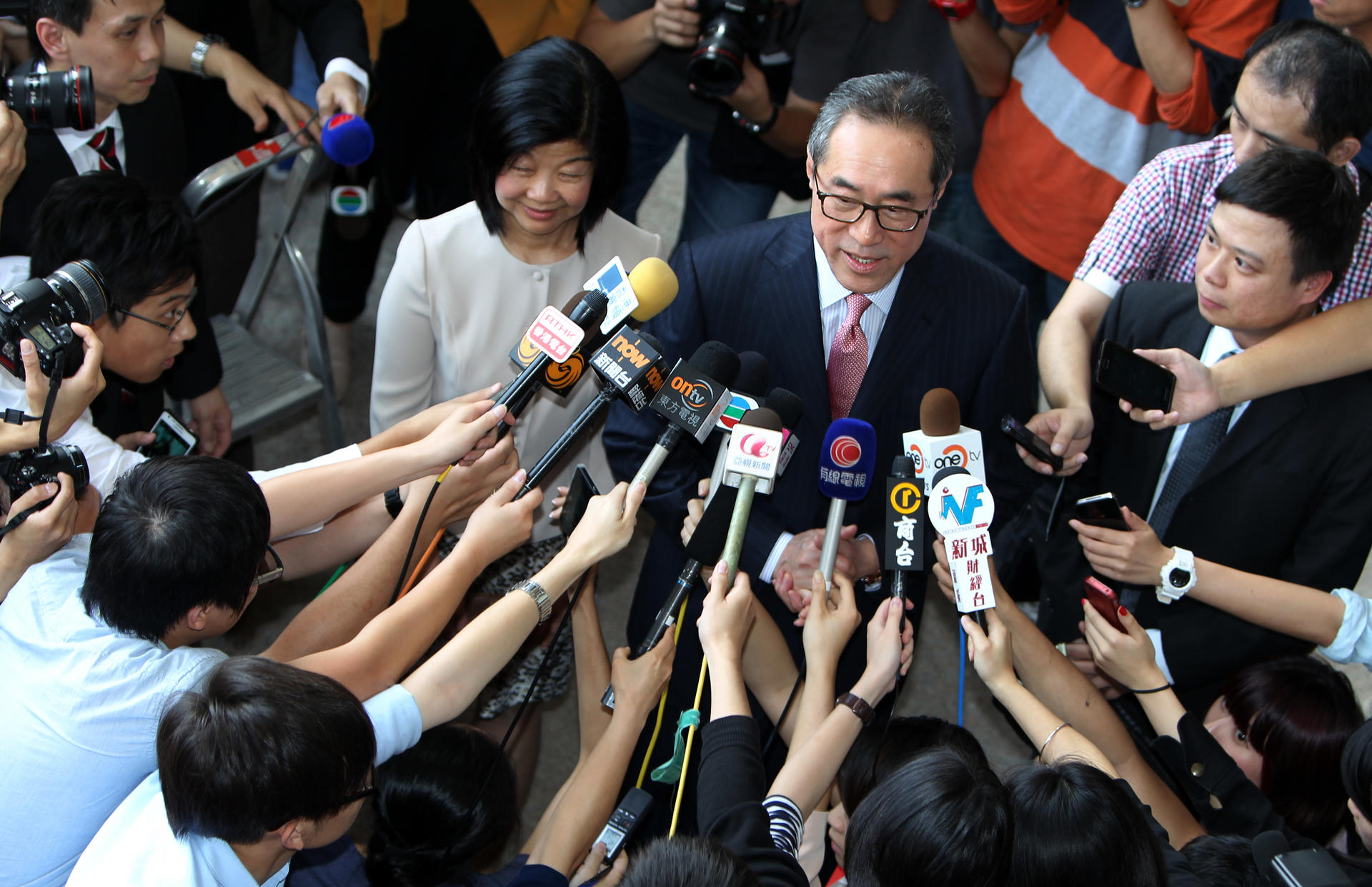 Lisa Kuo and Henry Tang face the media. Photo: Felix Wong