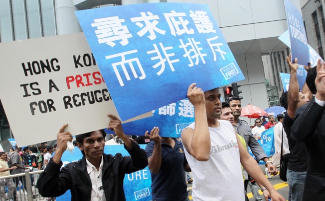 Hundreds of asylum seekers and torture claimants marched from Central to the Immigration Tower in Wan Chai yesterday to protest against what they see as the government’s failed screening process. Photo: May Tse