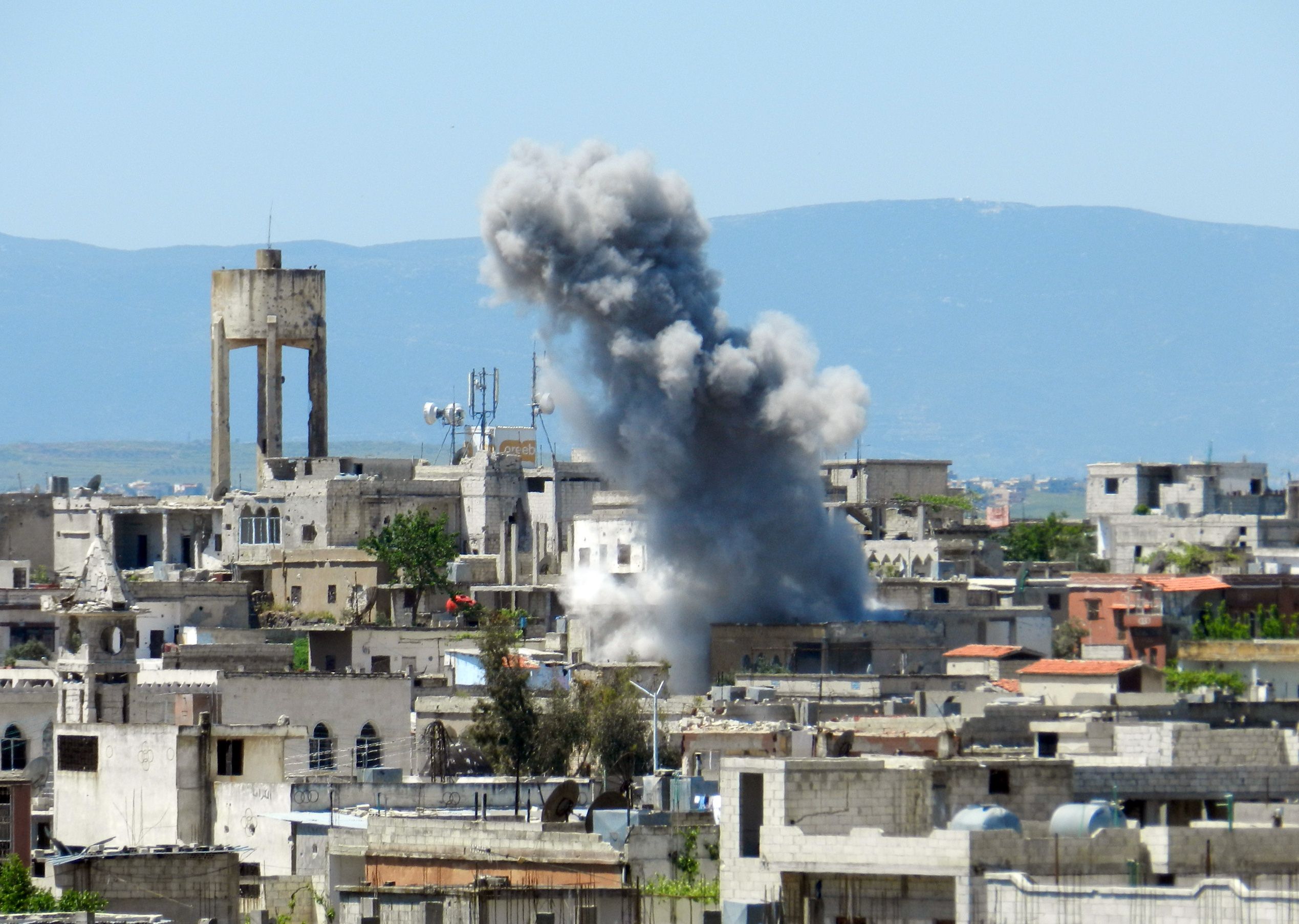 Smoke rising after heavy shelling in Houla in Syria's Homs province. Photo: AFP