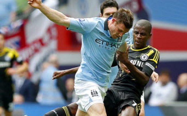 Chelsea's Ramires (right) in action against James Milner (left) of Manchester City during the English FA Cup semi final soccer match. The English FA is now searching for the living descendants of the founding fathers of football 