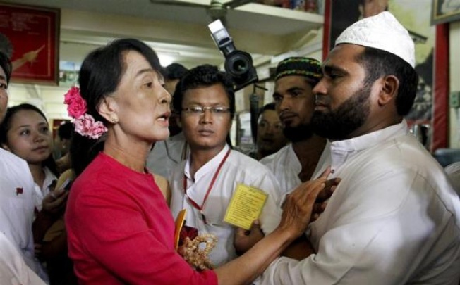 Myanmar's pro-democracy leader Aung San Suu Kyi talks to Myanmar Muslims leaders. There have been more anti-Muslim riots in Myanmar. Photo: Reuters