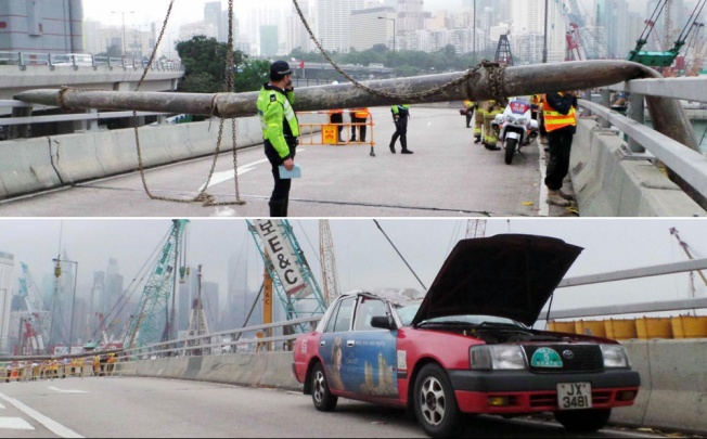 A chain securing the 12-metre pipe to a crane snapped and it crushed a taxi on the busy Island Eastern Corridor. Photos: SCMP