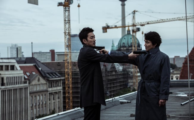 Ha Jung-woo (left) and Han Suk-kyu stand off in The Berlin File, directed by Ryoo Seung-wan. Photo: nathankimphoto