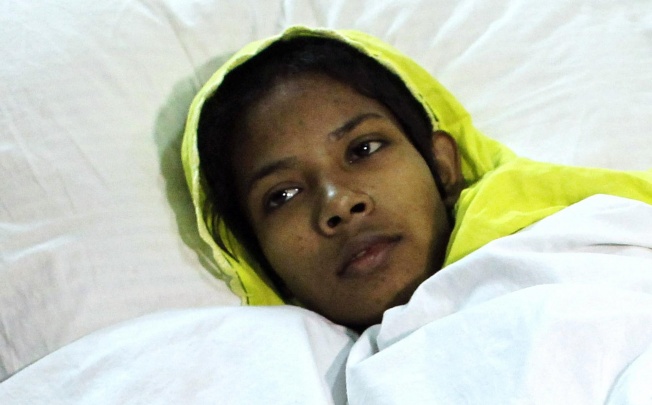 Reshma Begum hit a steel pipe to get attention. Photo: Reuters