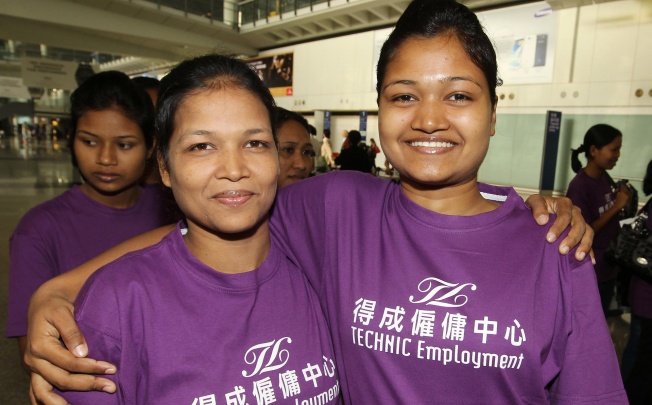 Domestic helpers Sefali Akter (left) and her daughter Mowsami pose for a picture after arriving in Hong Kong. Photo: Edward Wong