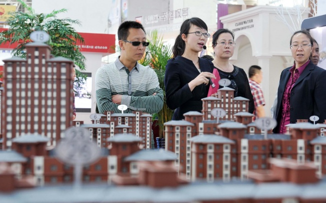 The authorities last month ordered strict implementation of a tax on property resales, denting the value of transactions. Photo: Xinhua