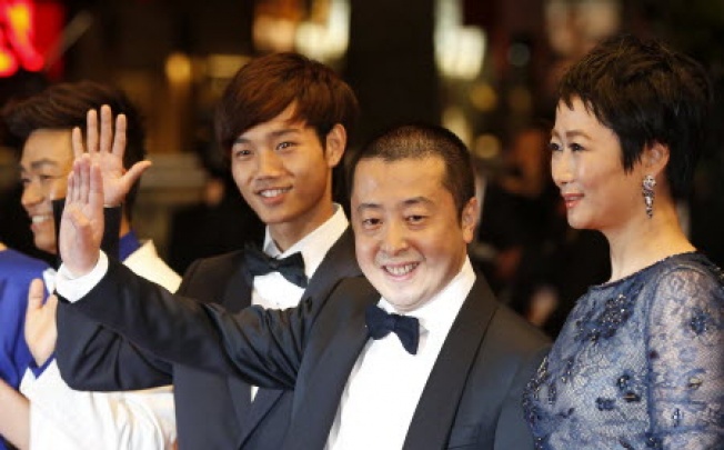  Chinese actor Luo Lanshan, director Jia Zhangke and his wife actress Zhao Tao  in Cannes. Photo: AFP 