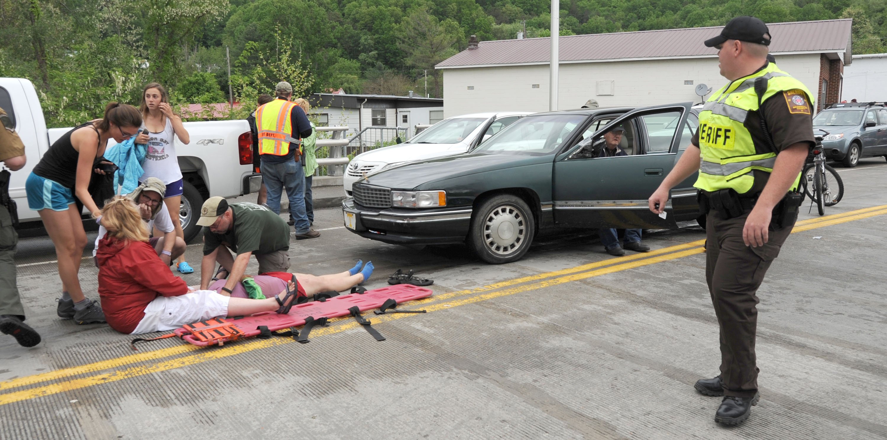 Emergency personnel respond to one of the people hit by a car during the beginning of the Hikers Parade at the Trail Days festival in Damascus, Virginia, USA. Photo: AP