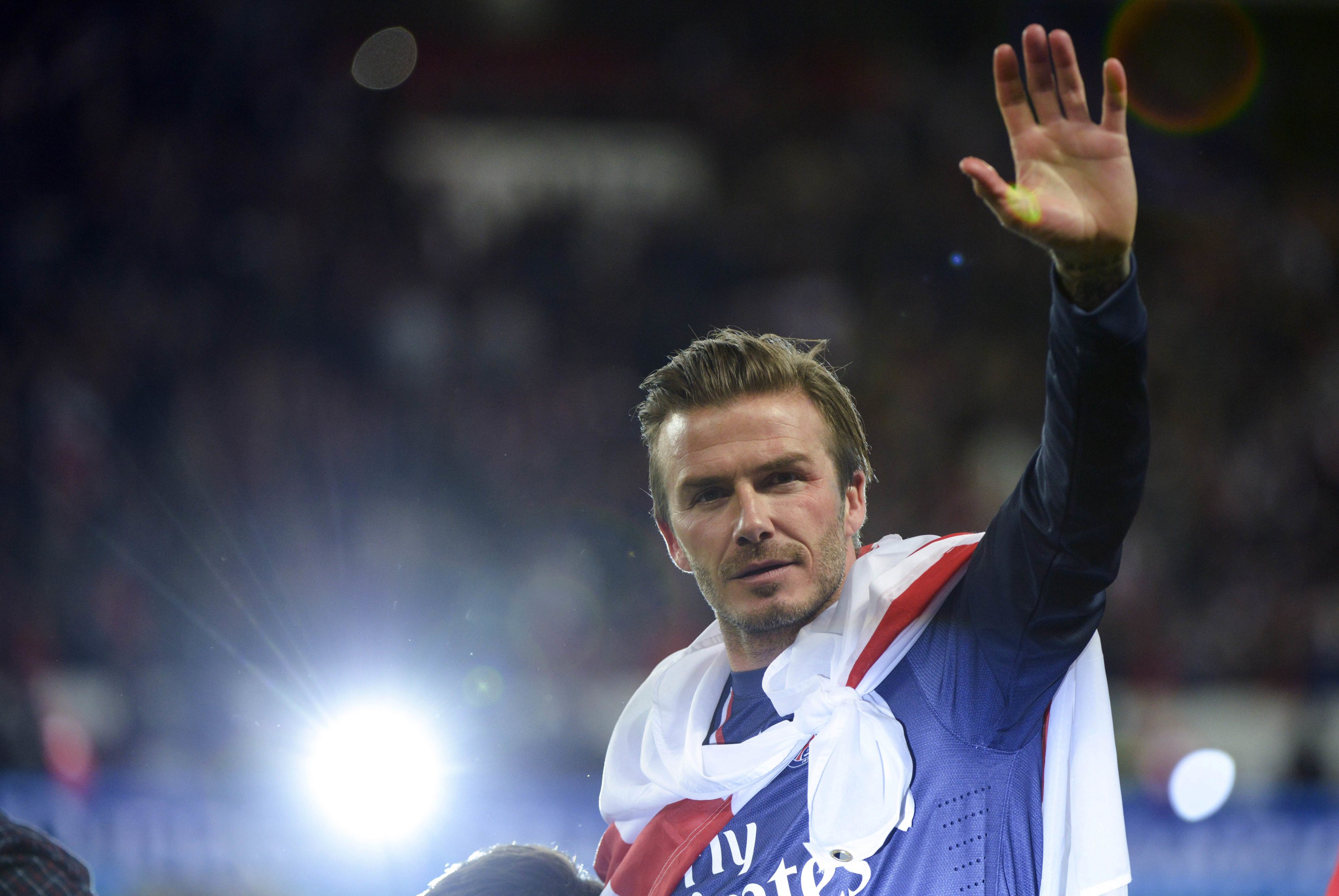 David Beckham waves after his final home appearance for Ligue 1 champions Paris Saint-Germain on Saturday before heading into retirement. Photo: AFP