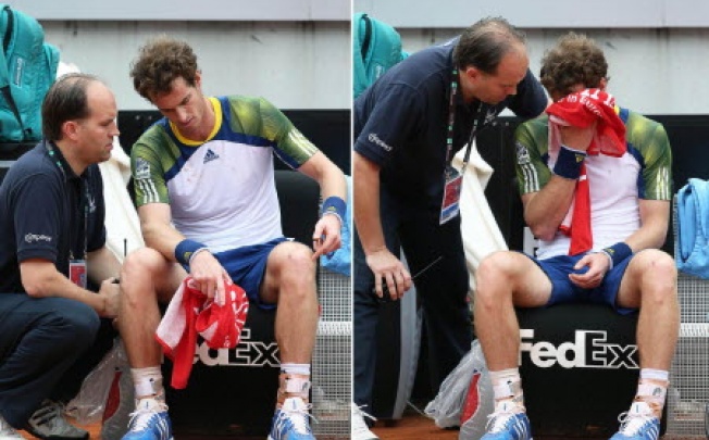 British tennis player Andy Murray (right) receiving treatment during his recent match against Spain's Marcel Granollers. Murray has pulled out of the French Open due to injury. Photo: EPA